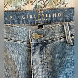 Women’s distressed girlfriend light blue jeans.